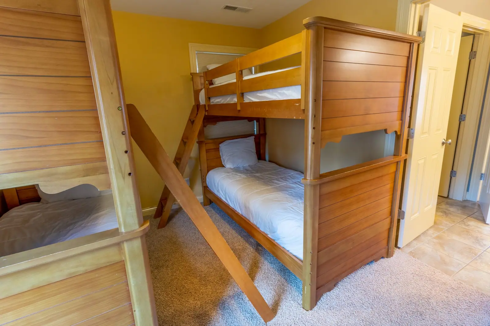 Bunk room with two wooden bunk beds