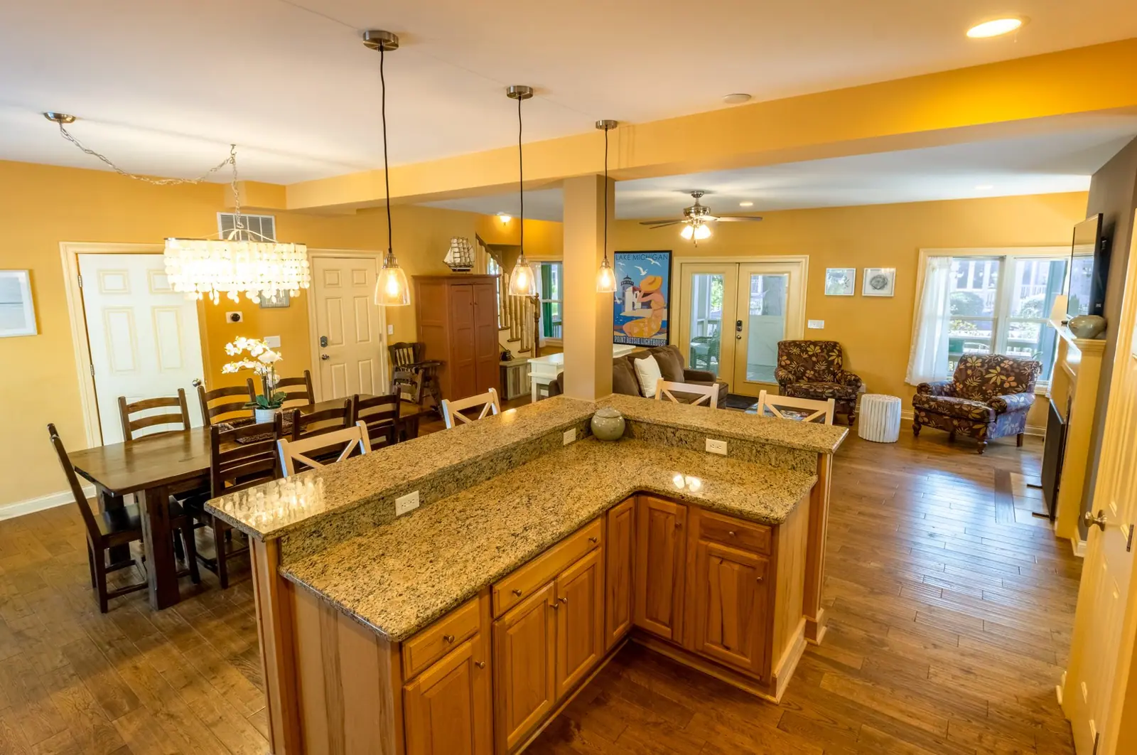 Granite kitchen island with seating, looking toward the dining table