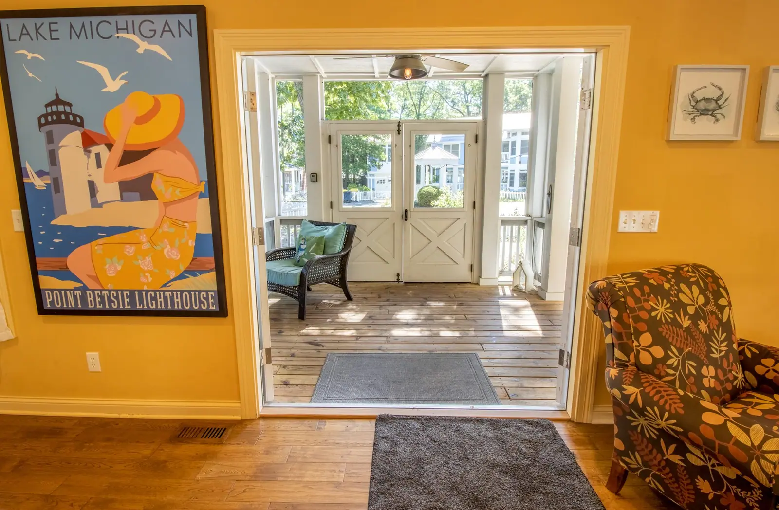 View from the living room through French doors to the first-floor screened porch