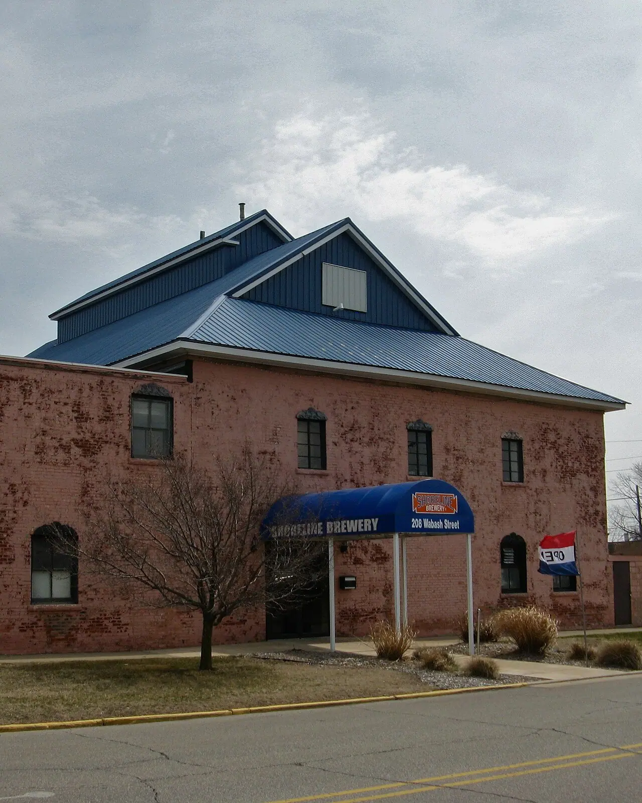 Shoreline Brewery's brick building and blue awning on Wabash Street