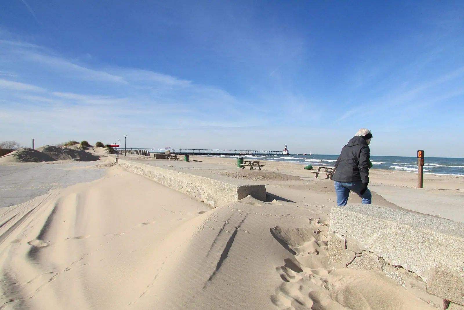 Washington Park beach with the pier and lighthouse in the distance