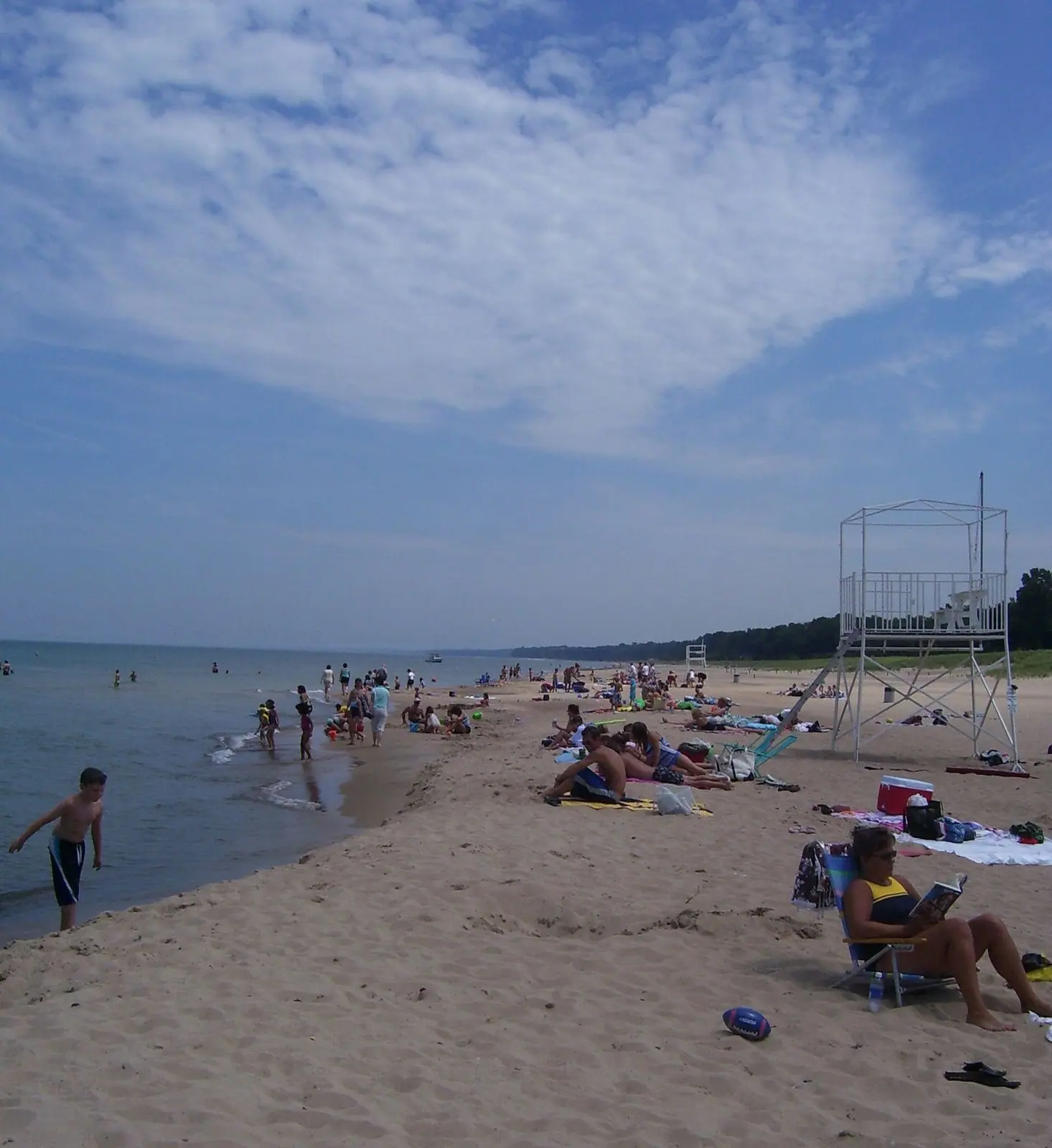 Families on the sand and in the water at New Buffalo beach