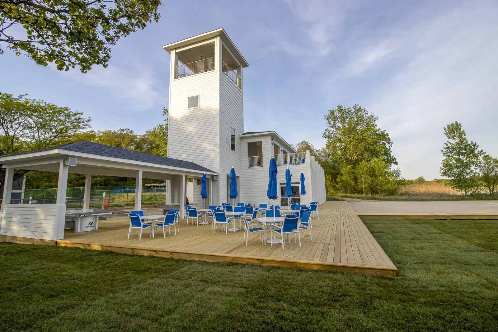 Beachwalk clubhouse with its white lookout tower and patio seating