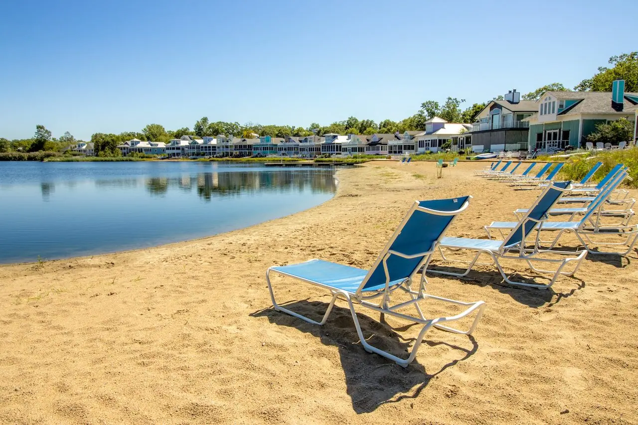 Lounge chairs on the sandy beach of Lake Kai