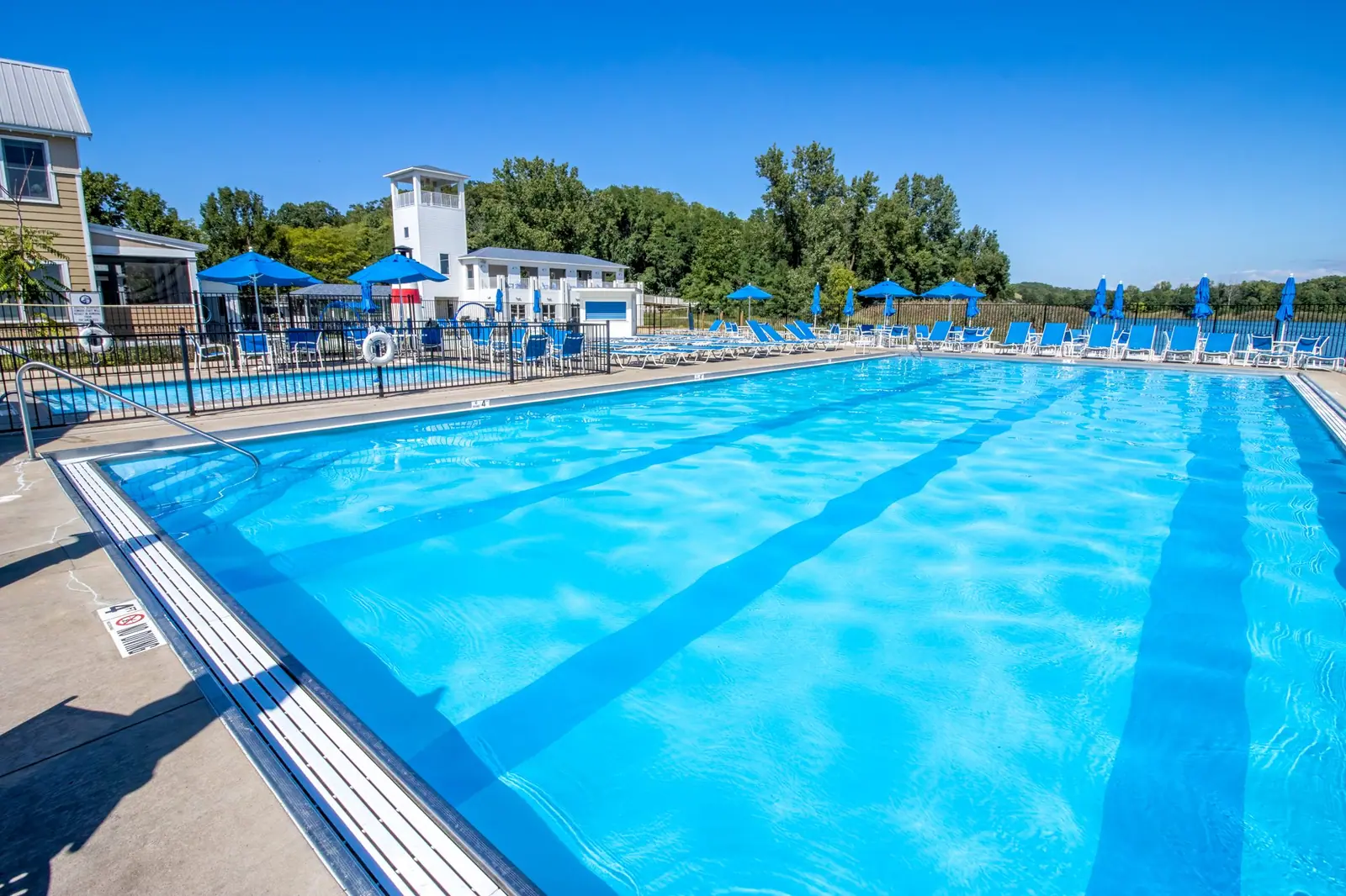 Beachwalk heated community pool with blue loungers