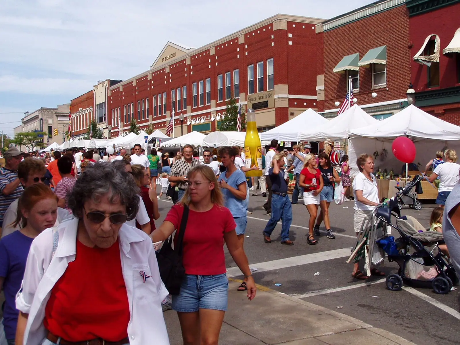 Crowds and booths on the street at the Valparaiso Popcorn Festival
